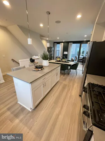 a view of a room with wooden floor and furniture
