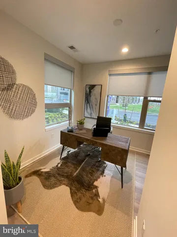 a workspace with furniture and a window