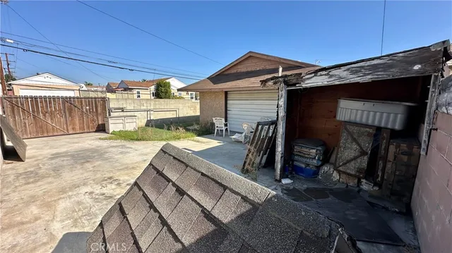 a view of a house with a wooden deck