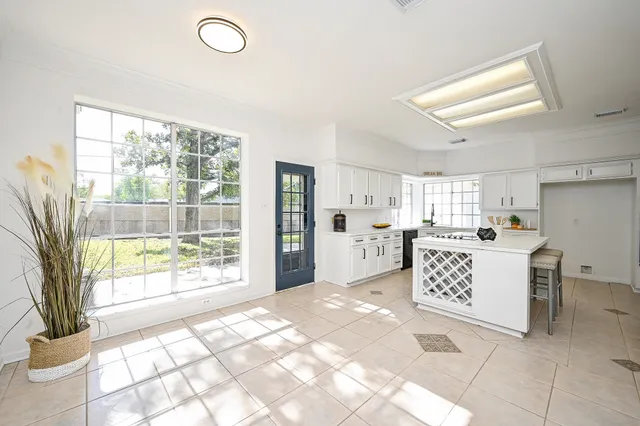 a view of kitchen with furniture and large window