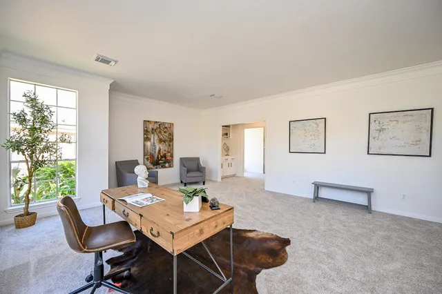 a view of a livingroom with furniture and window