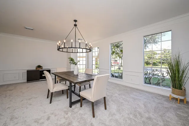a view of a dining room with furniture window and outside view