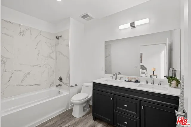 a bathroom with a sink a toilet and a bathtub
