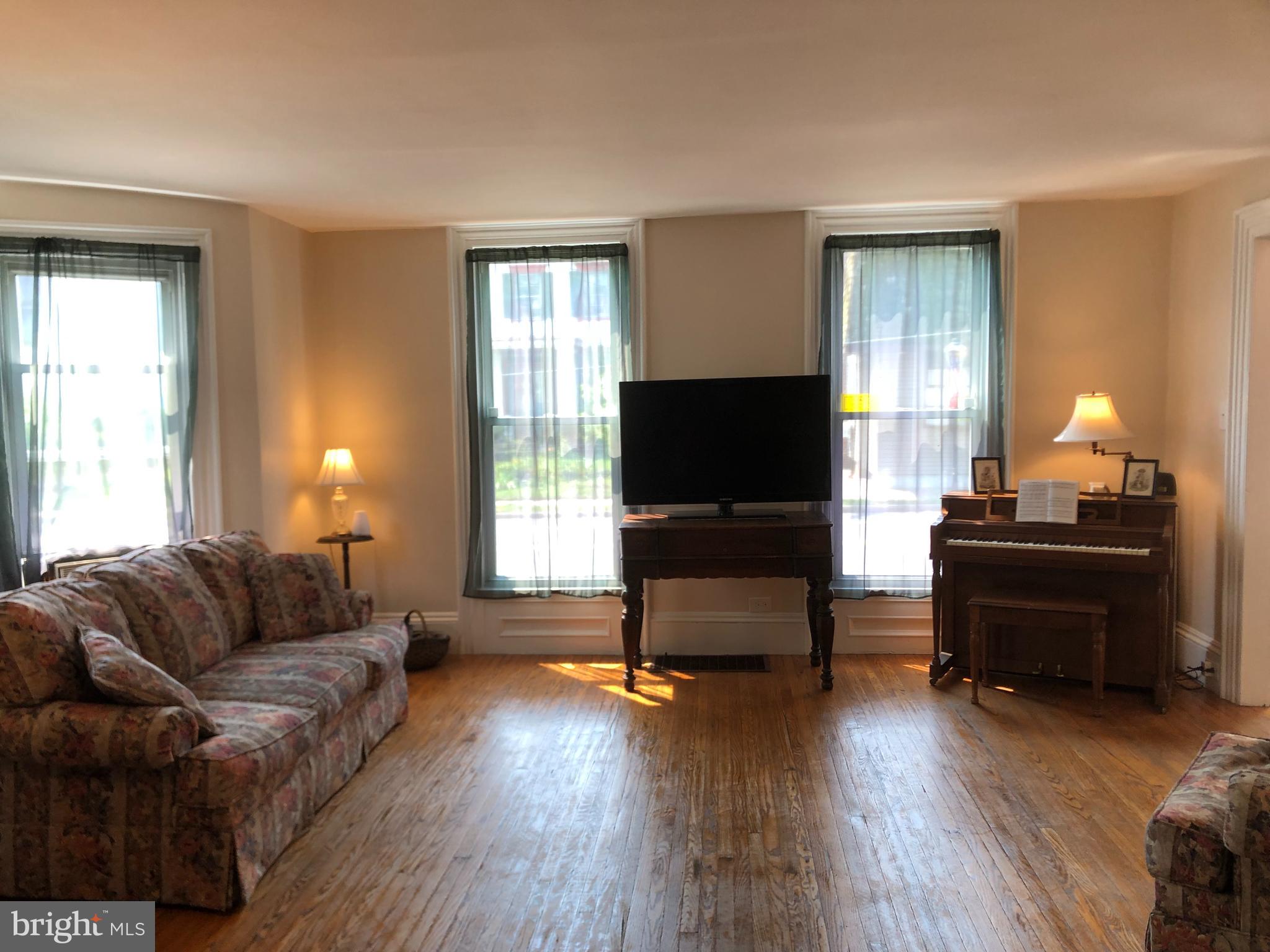 52 Hanover Street Pemberton, NJ 08068 - Photo 3 of 40 a living room with furniture and a flat screen tv