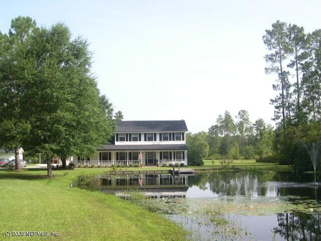 43085 Ratliff Road Callahan, FL 32011 - Photo 1 of 1 a front view of a house with a yard