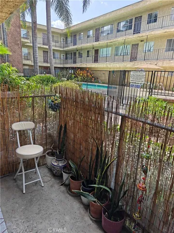 a view of a chair and table in the patio
