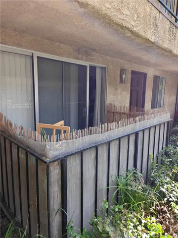 a balcony with wooden floor