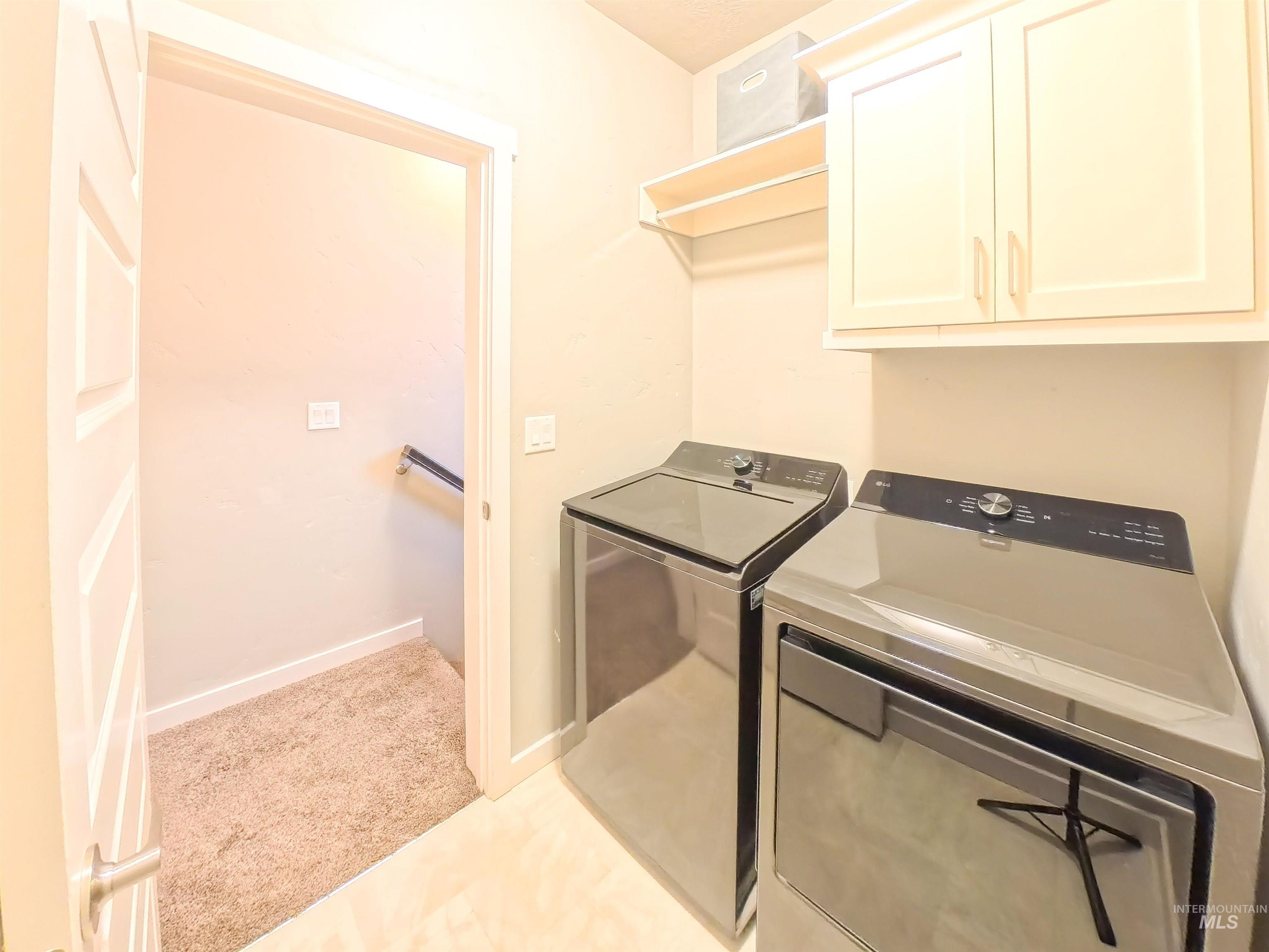 347 South Truss Lane Meridian, ID 83642 - Photo 10 of 24 Laundry room with cabinet space, separate washer and dryer, and light carpet