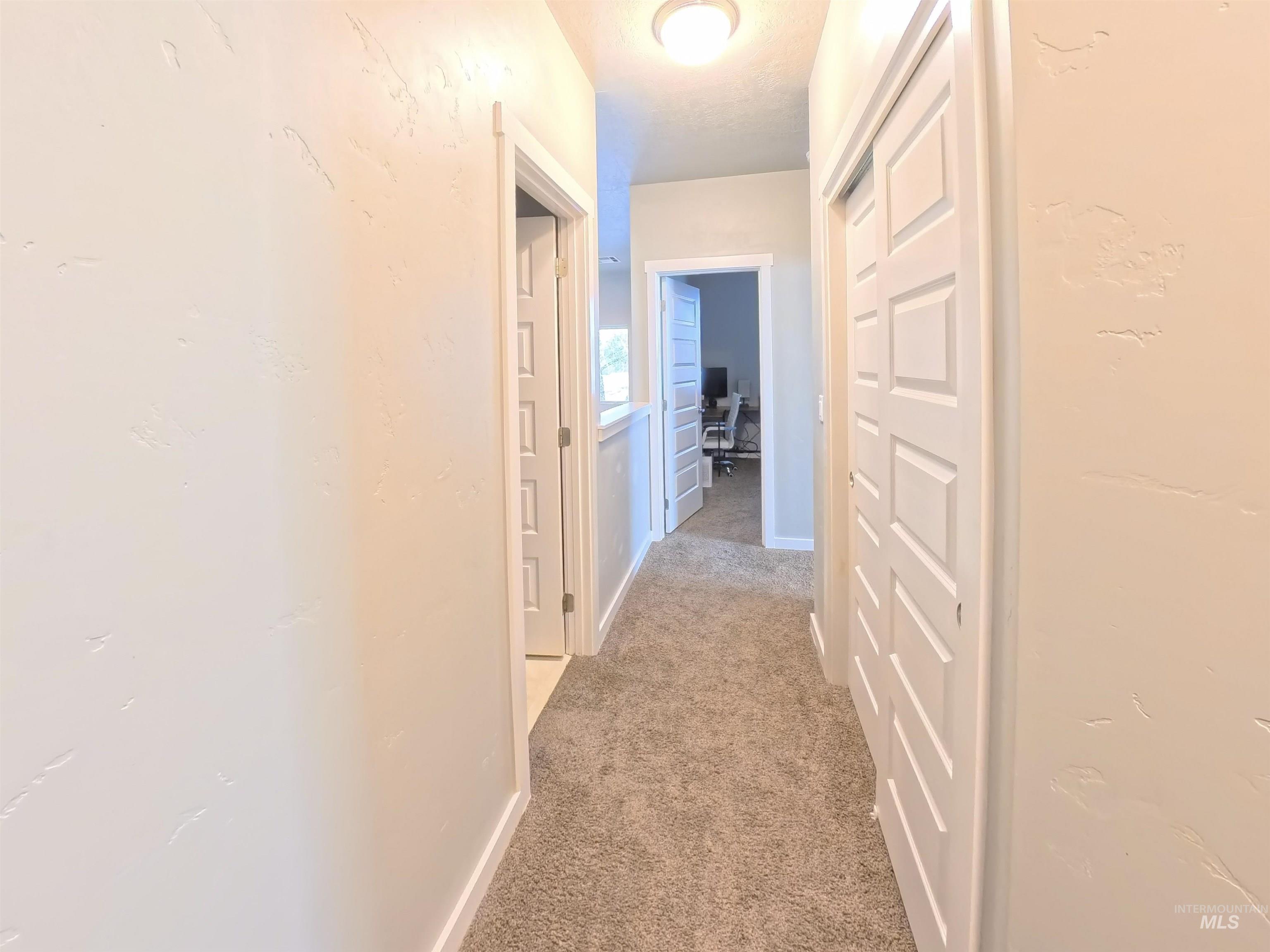 347 South Truss Lane Meridian, ID 83642 - Photo 16 of 24 Hall with light colored carpet and baseboards