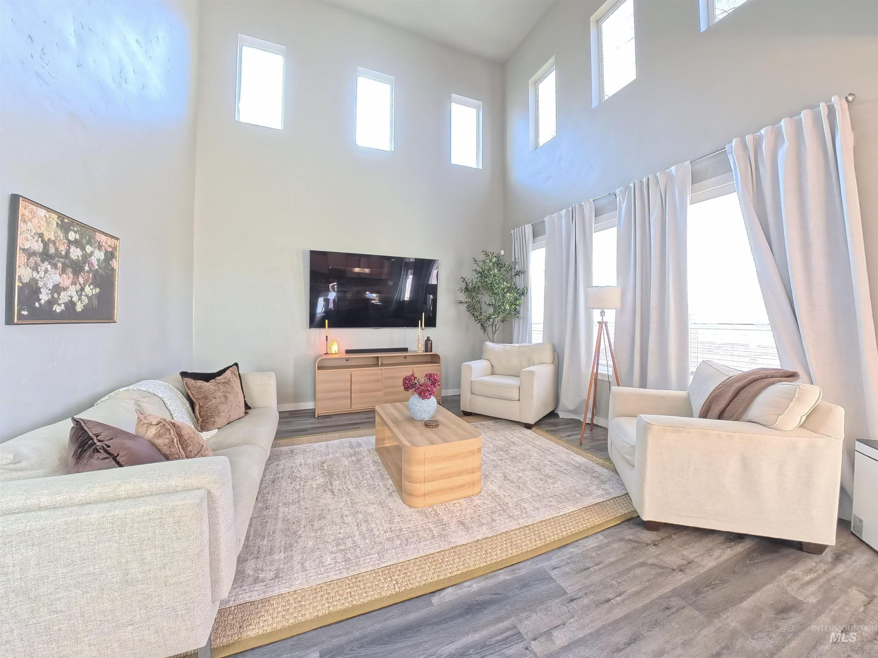 347 South Truss Lane Meridian, ID 83642 - Photo 5 of 24 Living room with wood finished floors and a high ceiling