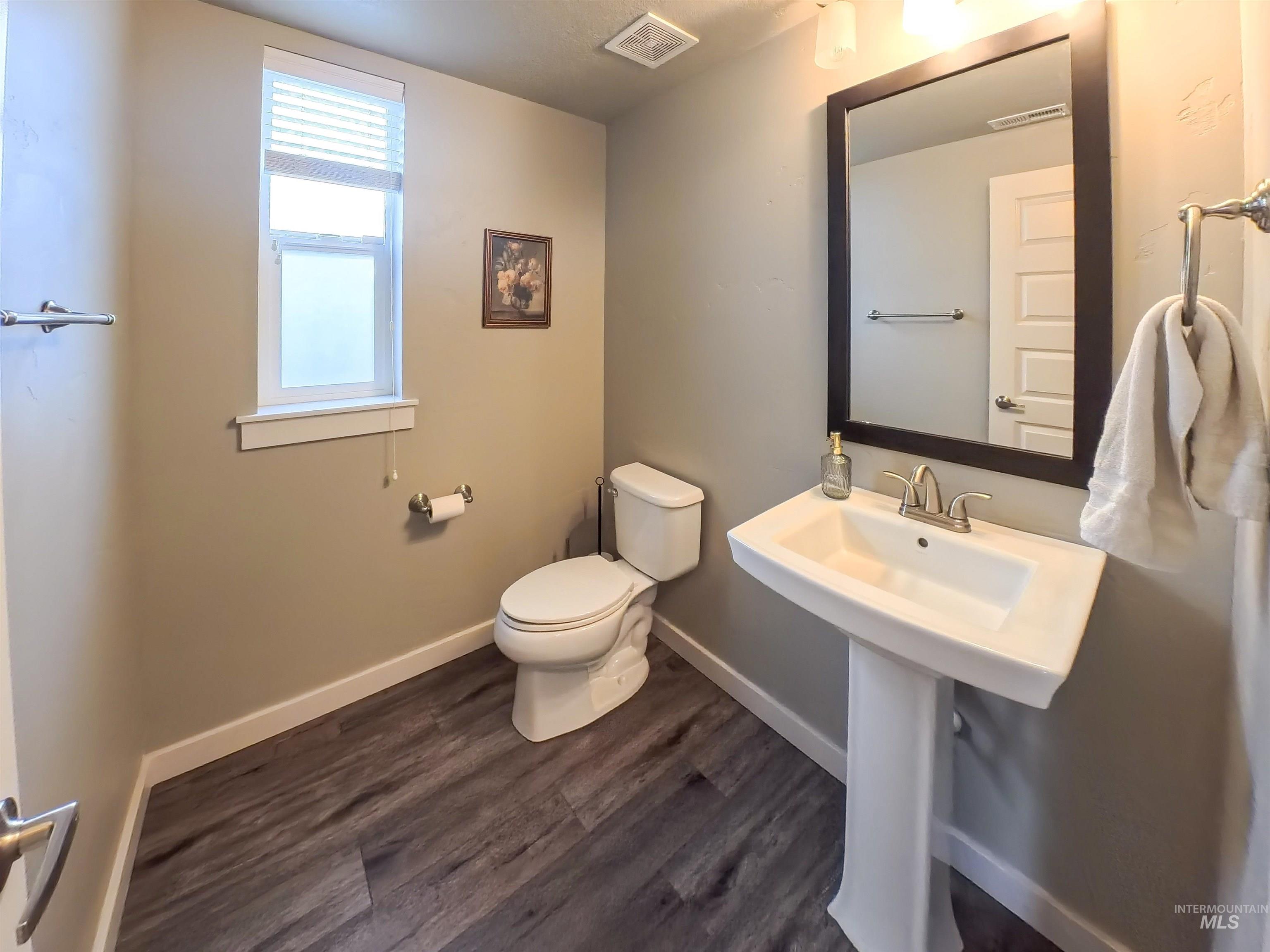 347 South Truss Lane Meridian, ID 83642 - Photo 7 of 24 Bathroom featuring toilet and dark wood-style flooring