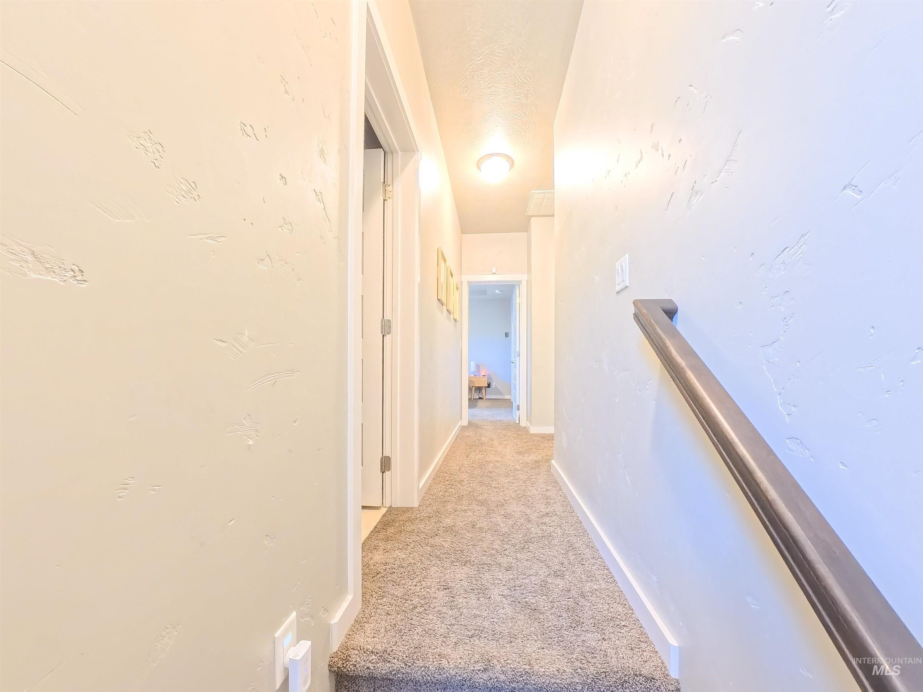 347 South Truss Lane Meridian, ID 83642 - Photo 9 of 24 Hall with light carpet and baseboards