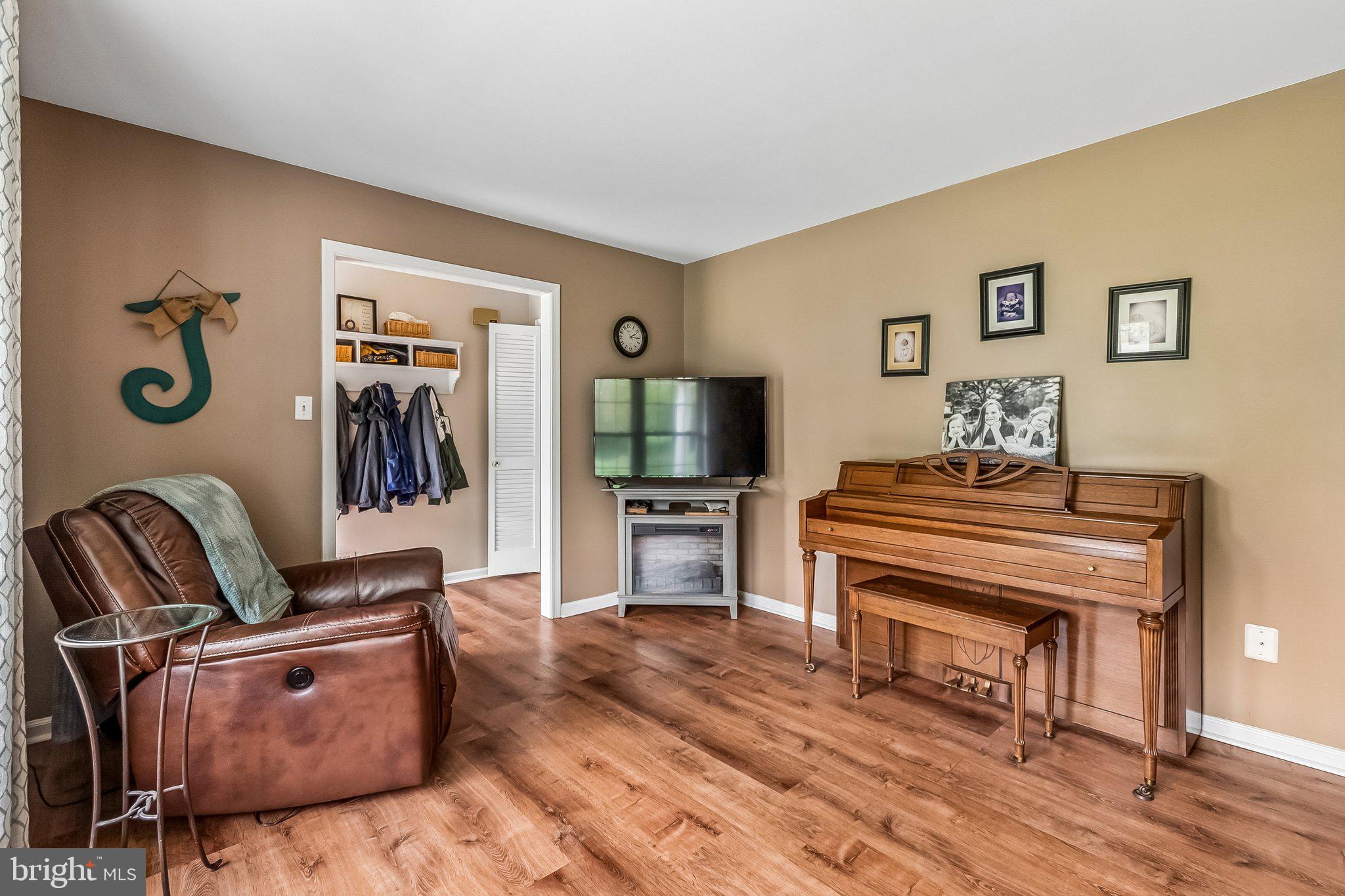 6774 Grays Mill Road Warrenton, VA 20187 - Photo 14 of 35 a living room with furniture and a flat screen tv