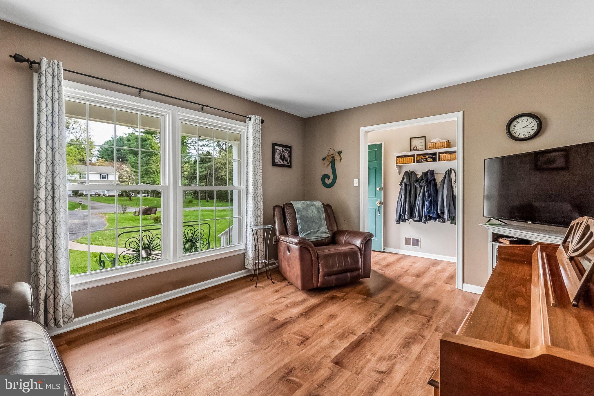6774 Grays Mill Road Warrenton, VA 20187 - Photo 15 of 35 a living room with furniture and a flat screen tv