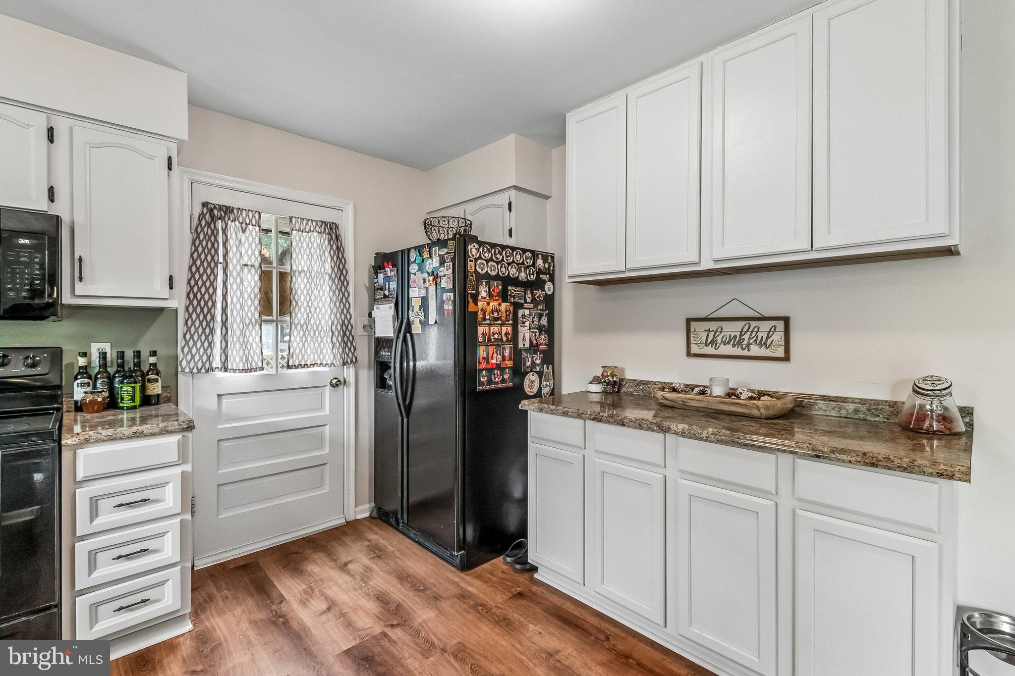 6774 Grays Mill Road Warrenton, VA 20187 - Photo 19 of 35 a kitchen with stainless steel appliances granite countertop a refrigerator and cabinets
