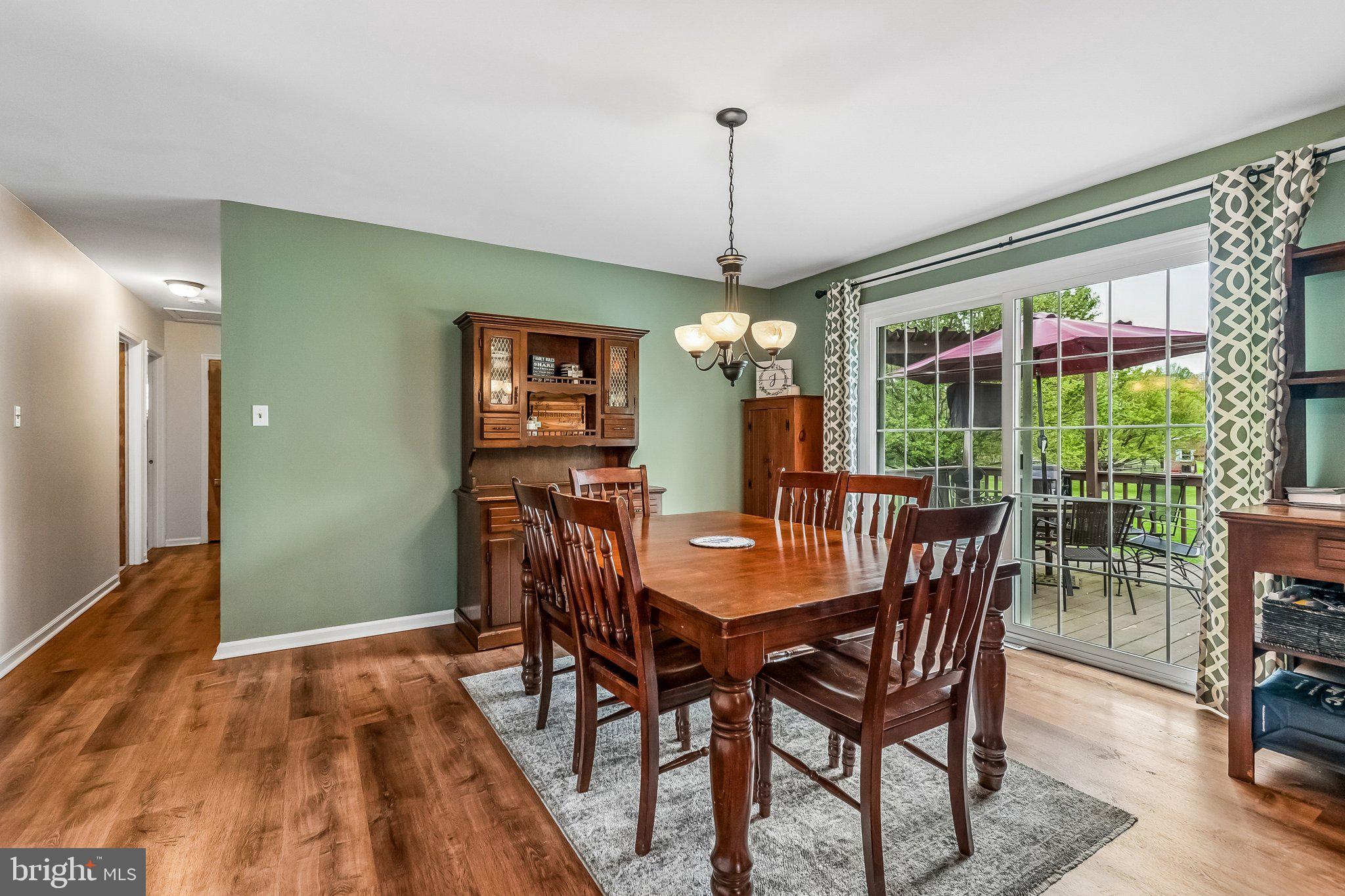 6774 Grays Mill Road Warrenton, VA 20187 - Photo 21 of 35 a view of a dining room with furniture window and wooden floor