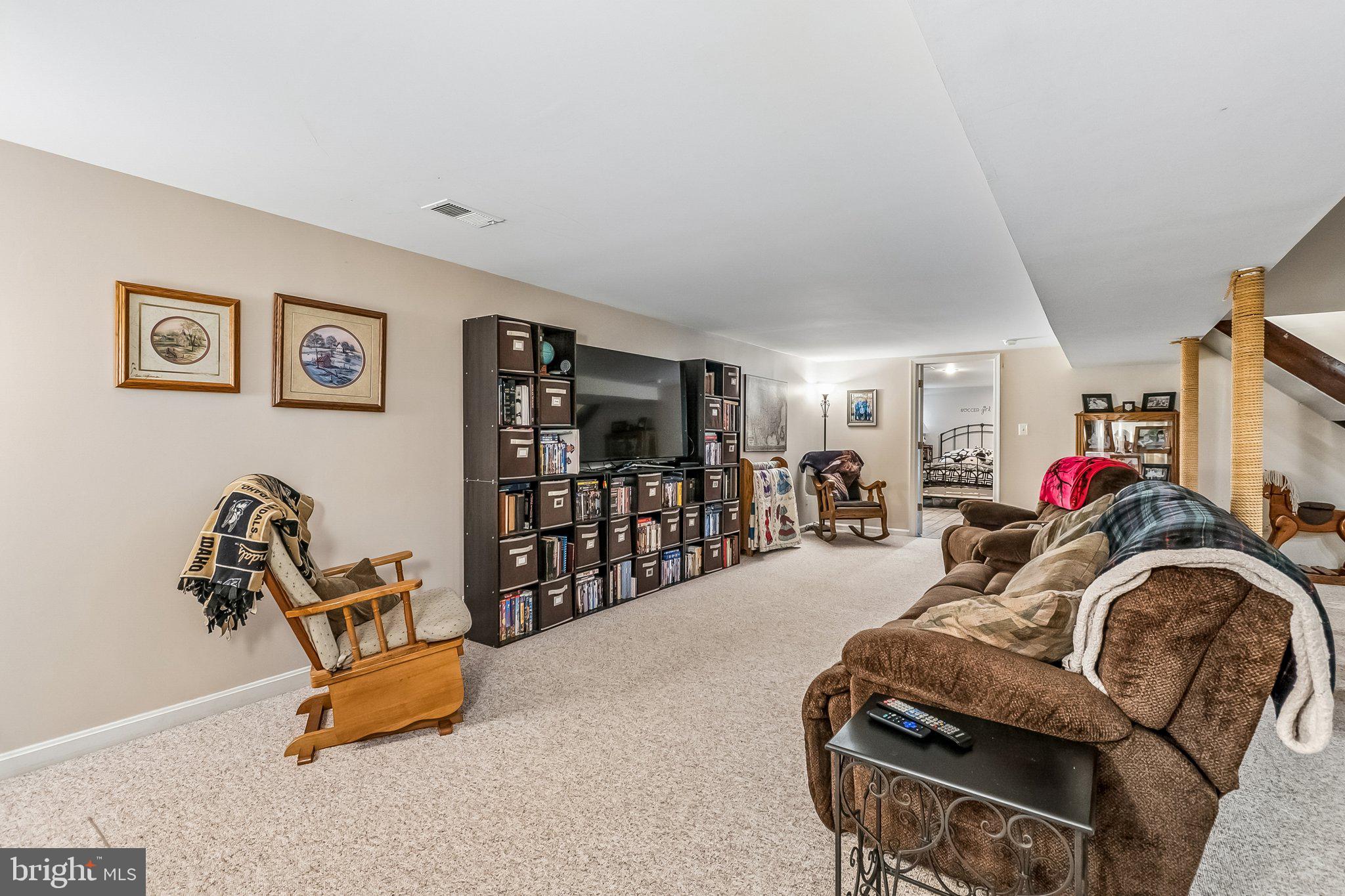 6774 Grays Mill Road Warrenton, VA 20187 - Photo 32 of 35 a room with gym equipment and a flat screen tv