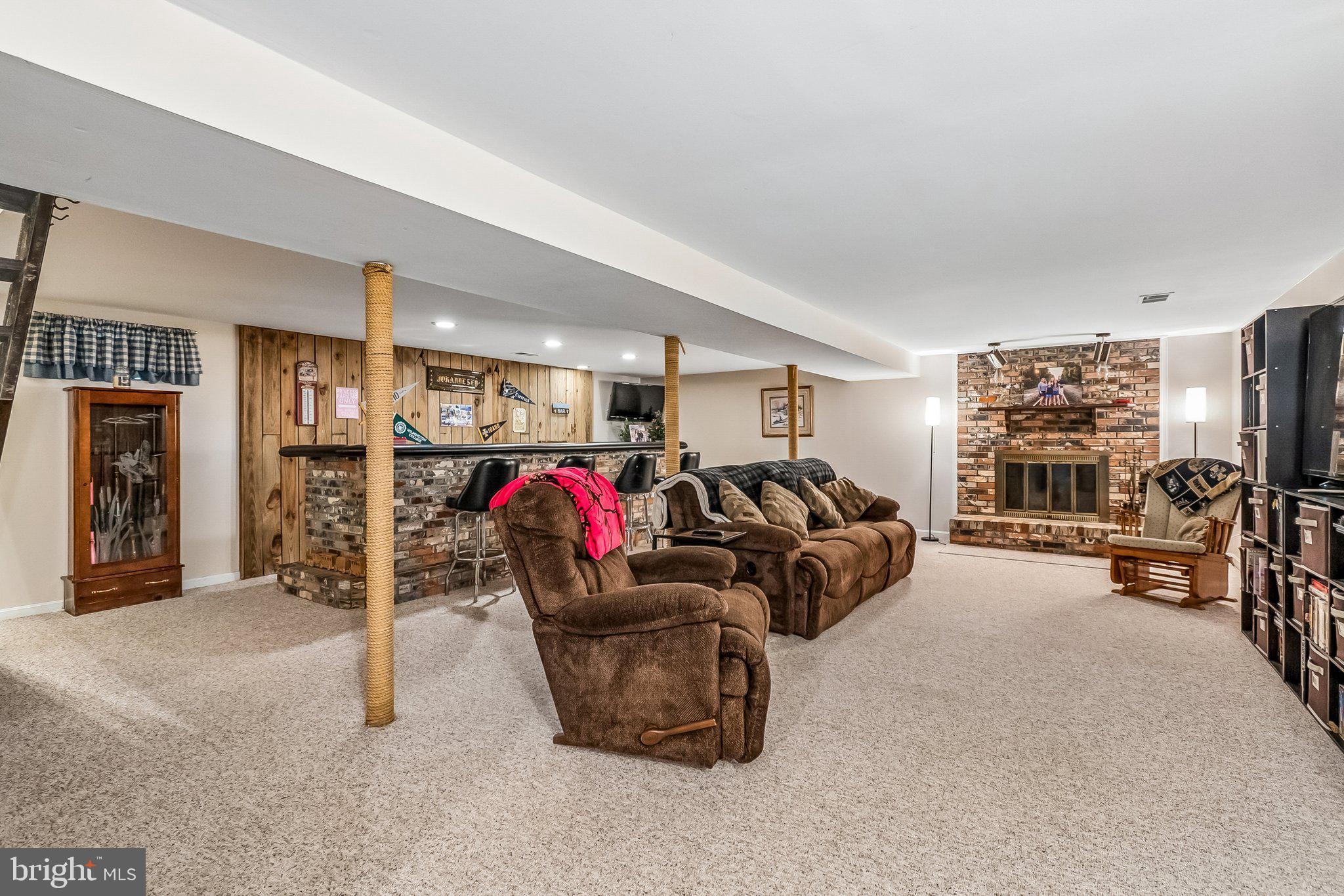 6774 Grays Mill Road Warrenton, VA 20187 - Photo 33 of 35 a living room with furniture a large window and gym equipment