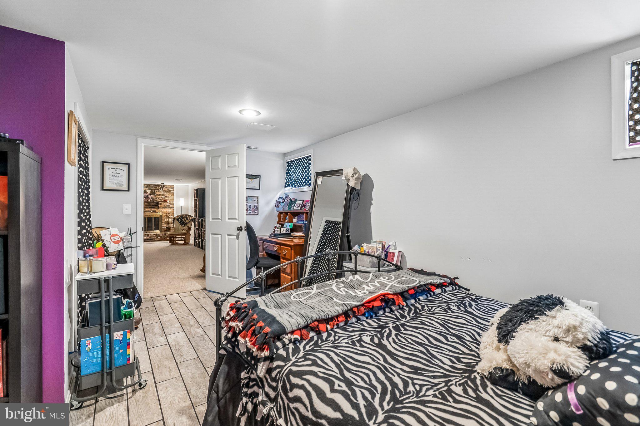 6774 Grays Mill Road Warrenton, VA 20187 - Photo 35 of 35 a bed room with a bed and a wooden floor