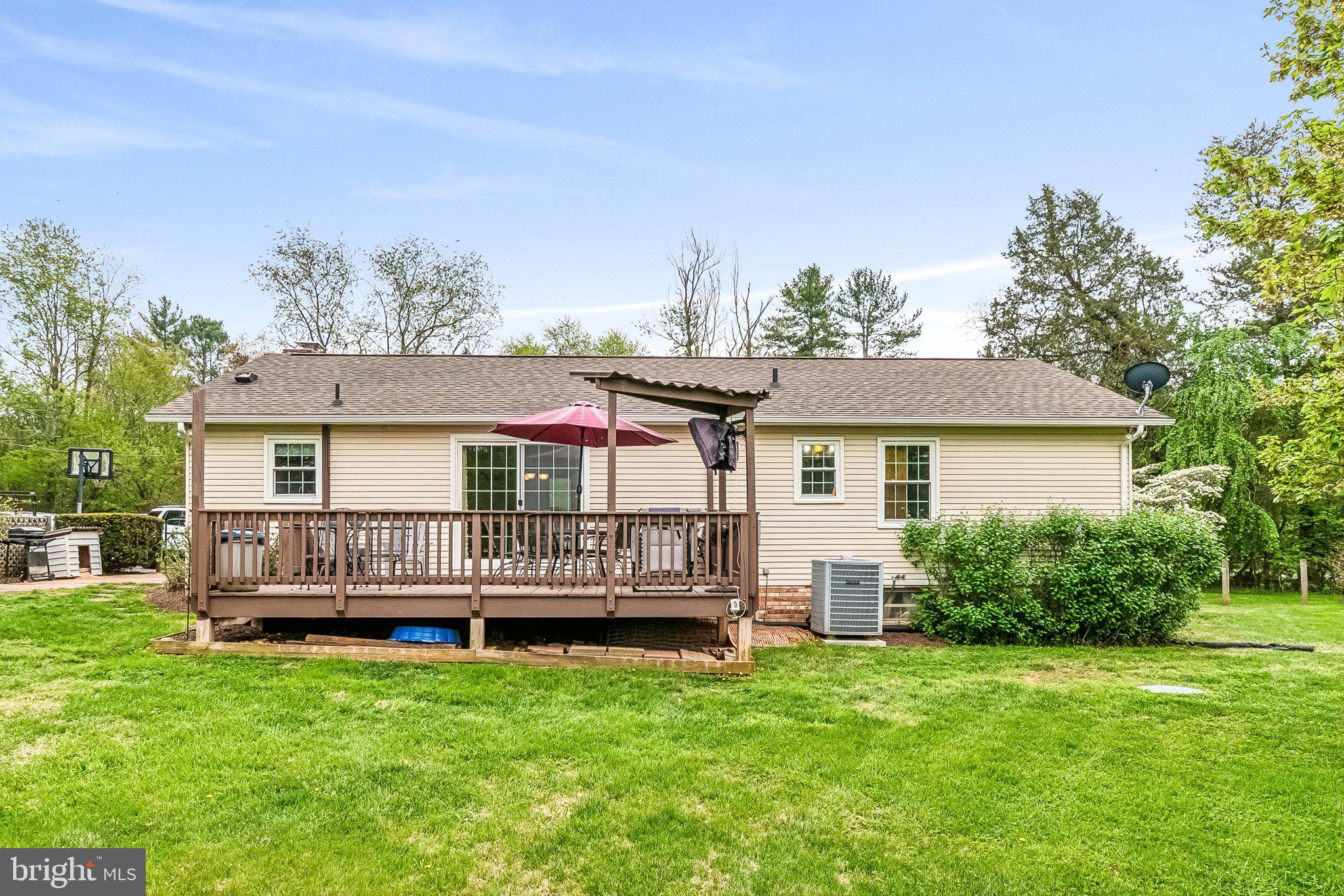 6774 Grays Mill Road Warrenton, VA 20187 - Photo 8 of 35 a front view of a house with a garden