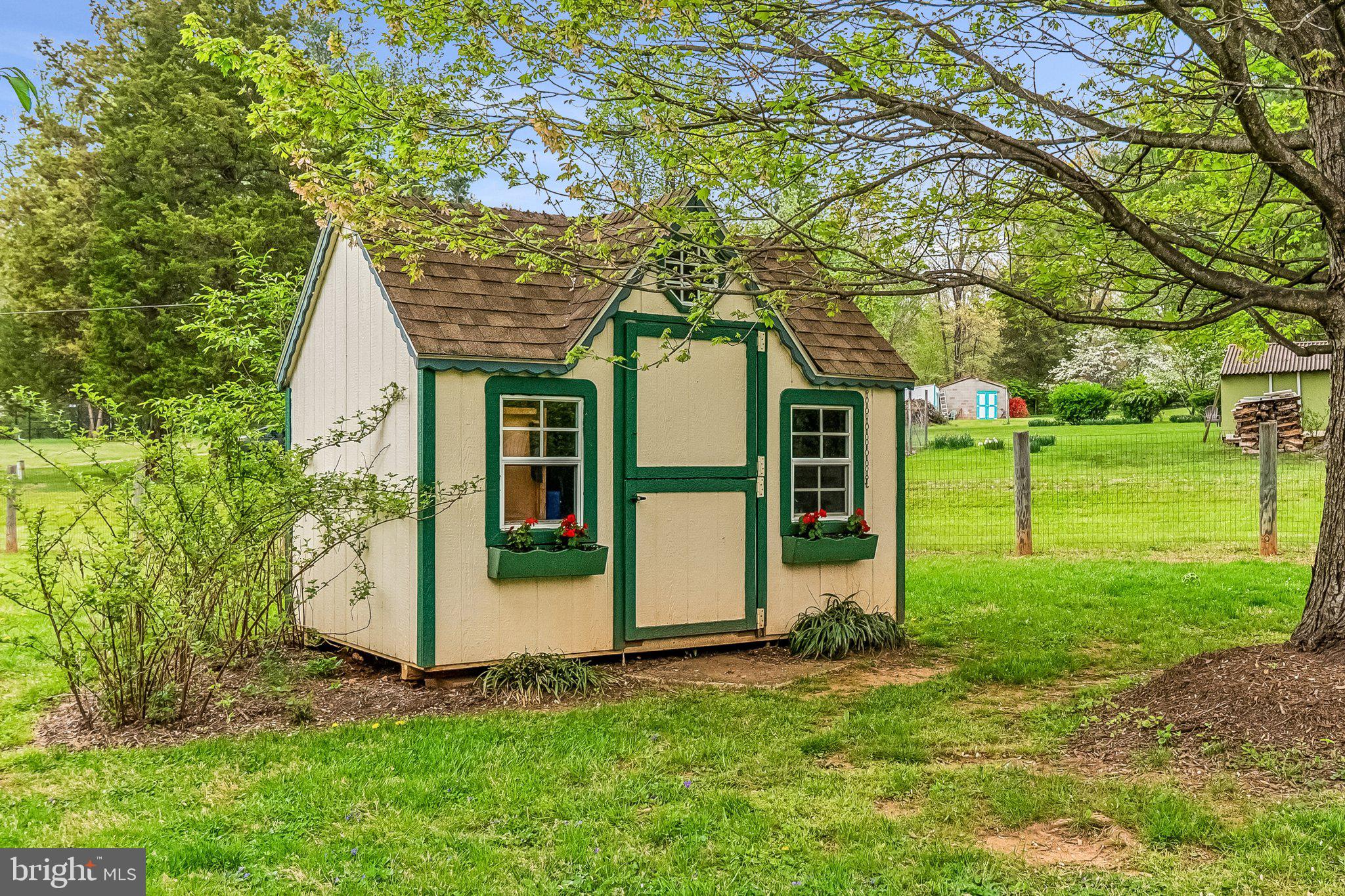 6774 Grays Mill Road Warrenton, VA 20187 - Photo 9 of 35 a view of a house with backyard and a tree