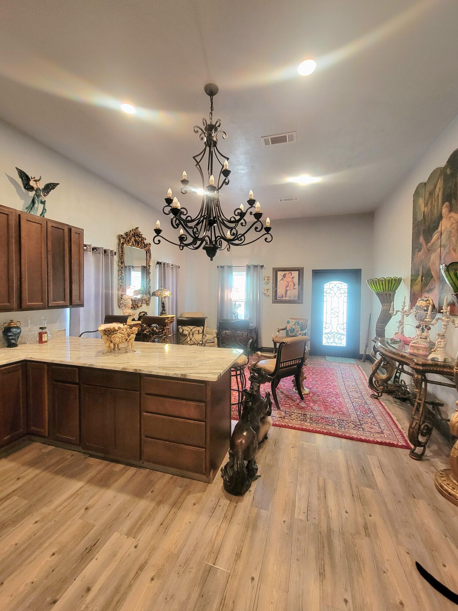 1508 Crooked Creek Road Ponce de Leon, FL 32455 - Photo 17 of 64 a large room with stainless steel appliances lots of wooden furniture a rug kitchen view and living room view