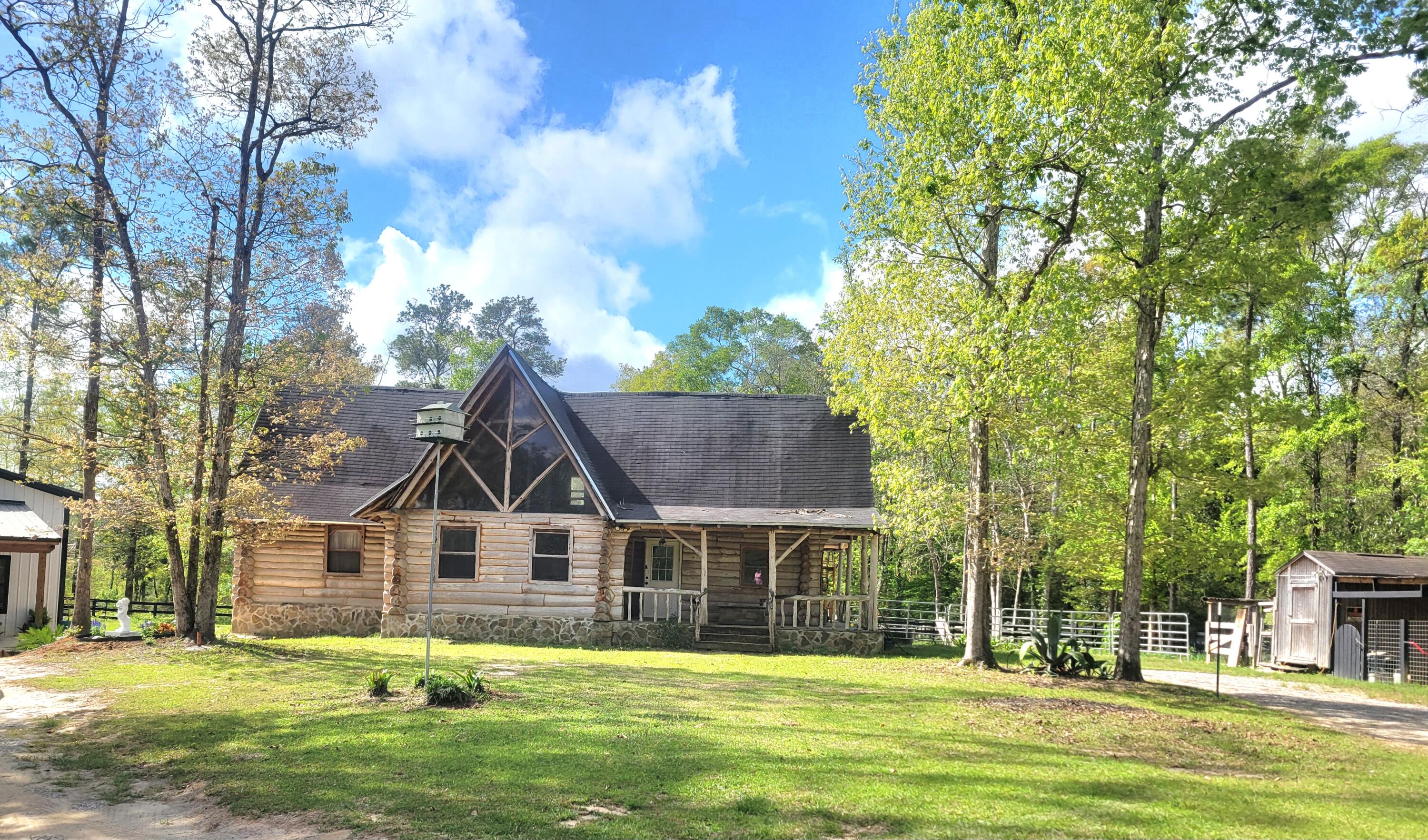 1508 Crooked Creek Road Ponce de Leon, FL 32455 - Photo 2 of 62 a front view of a house with a yard