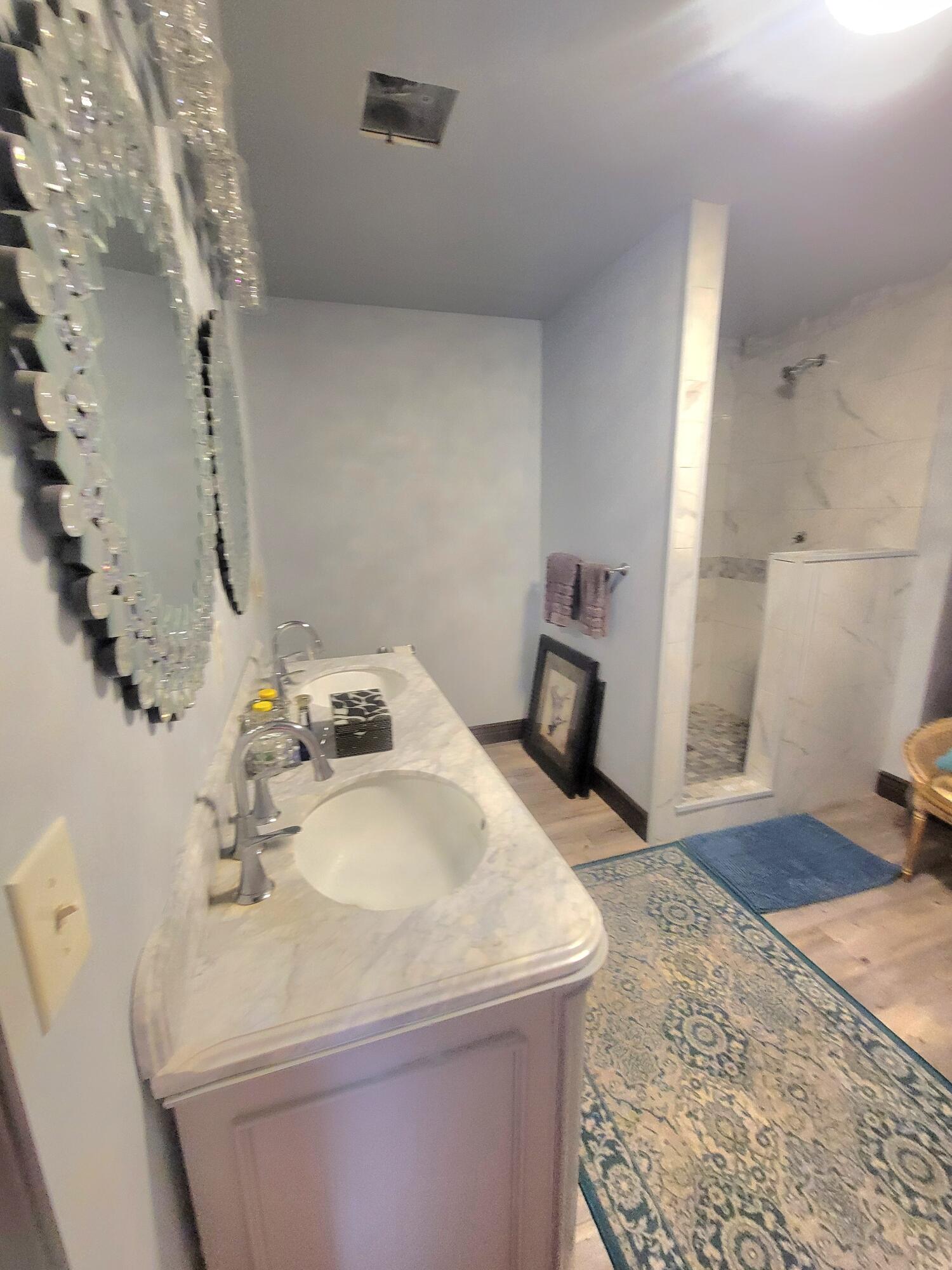 1508 Crooked Creek Road Ponce de Leon, FL 32455 - Photo 22 of 62 a bathroom with a sink and a mirror