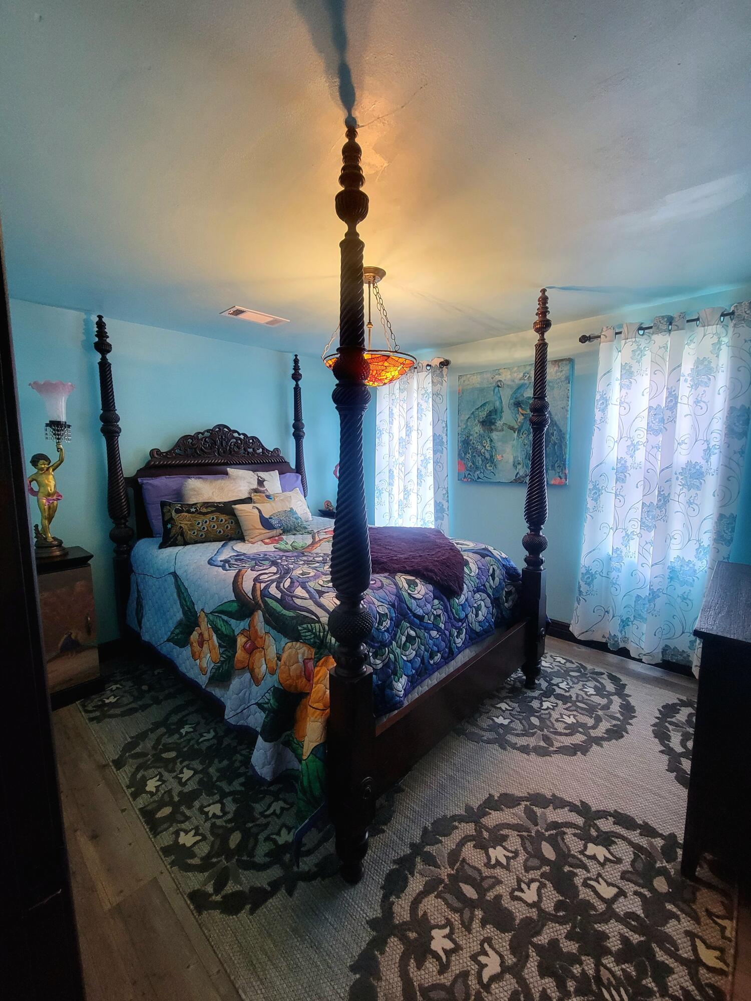 1508 Crooked Creek Road Ponce de Leon, FL 32455 - Photo 30 of 62 a bedroom with bed and a chandelier