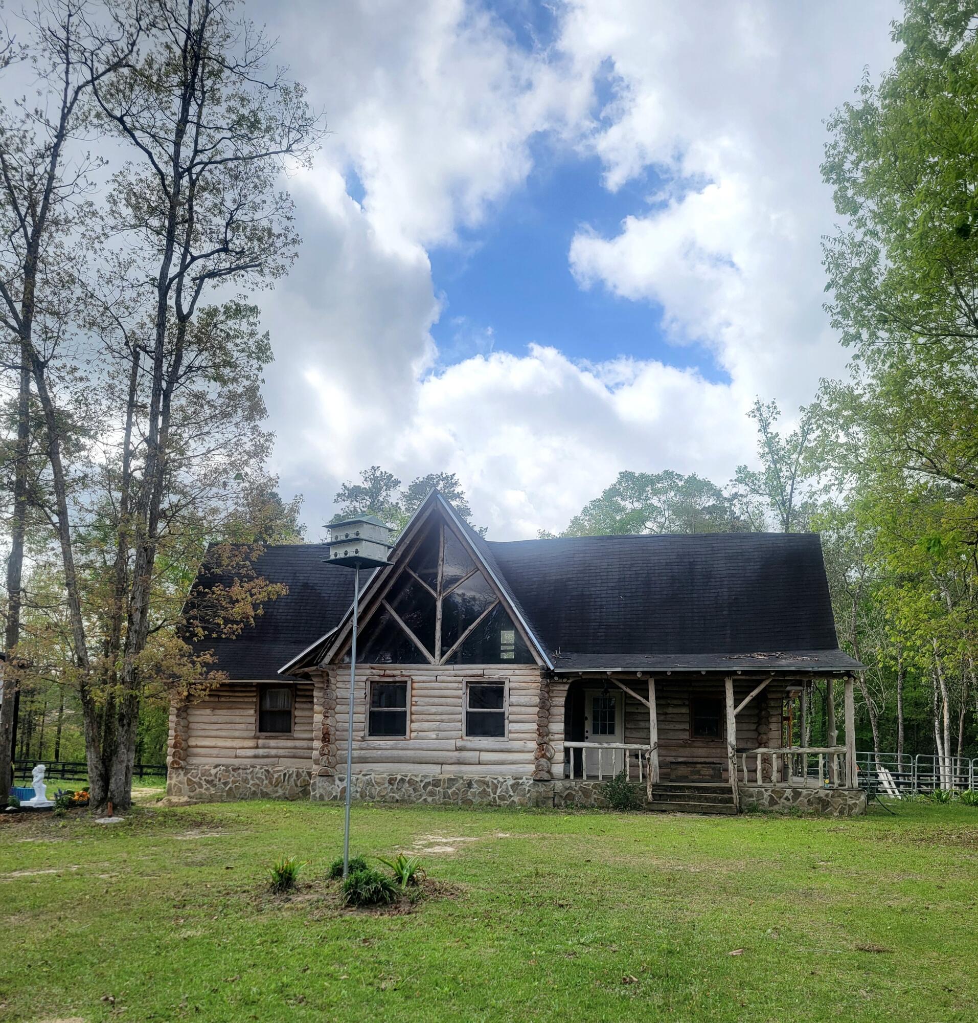 1508 Crooked Creek Road Ponce de Leon, FL 32455 - Photo 34 of 62 a front view of a house with a garden and trees