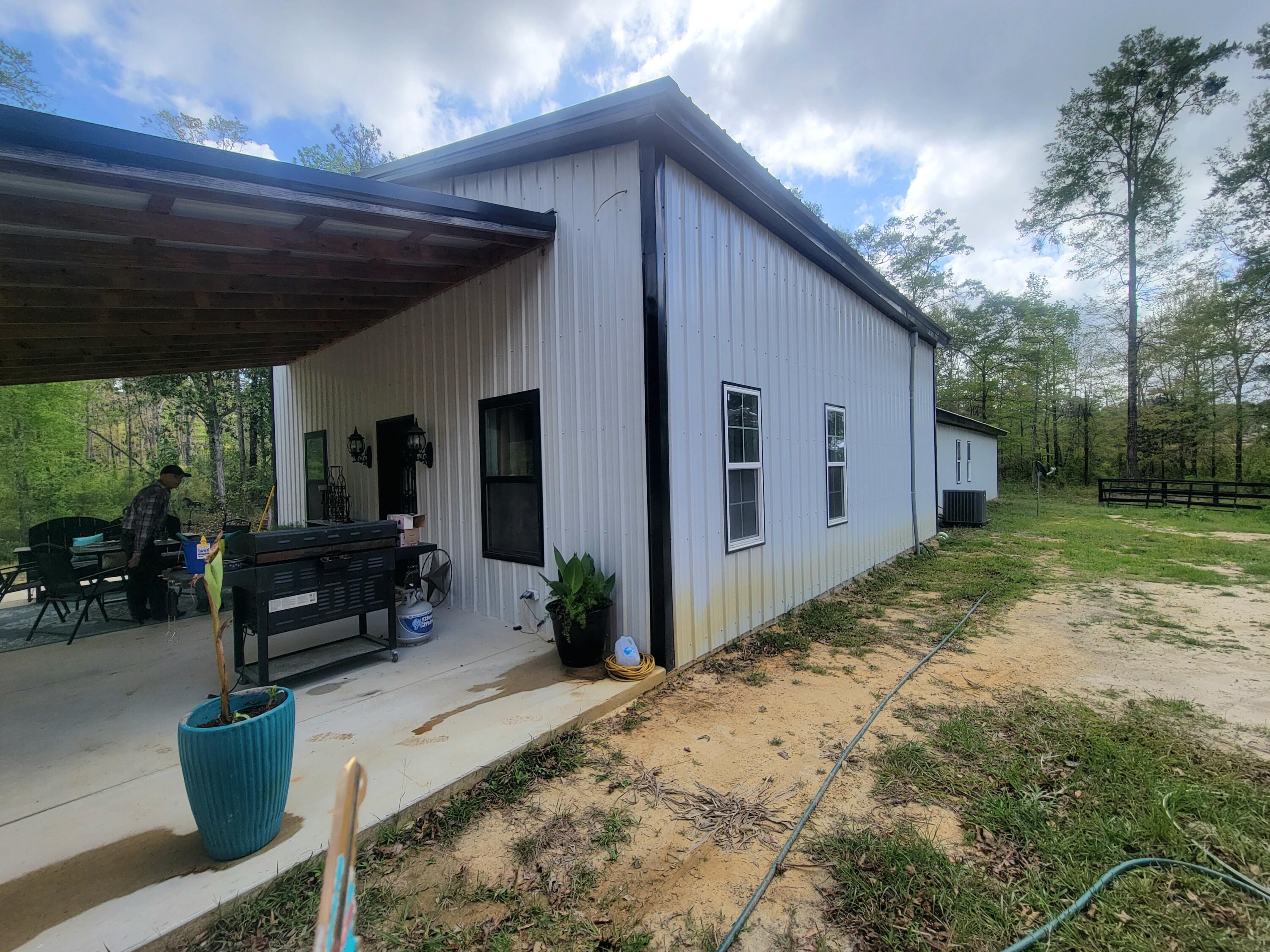 1508 Crooked Creek Road Ponce de Leon, FL 32455 - Photo 34 of 64 a backyard of a house with garden and patio