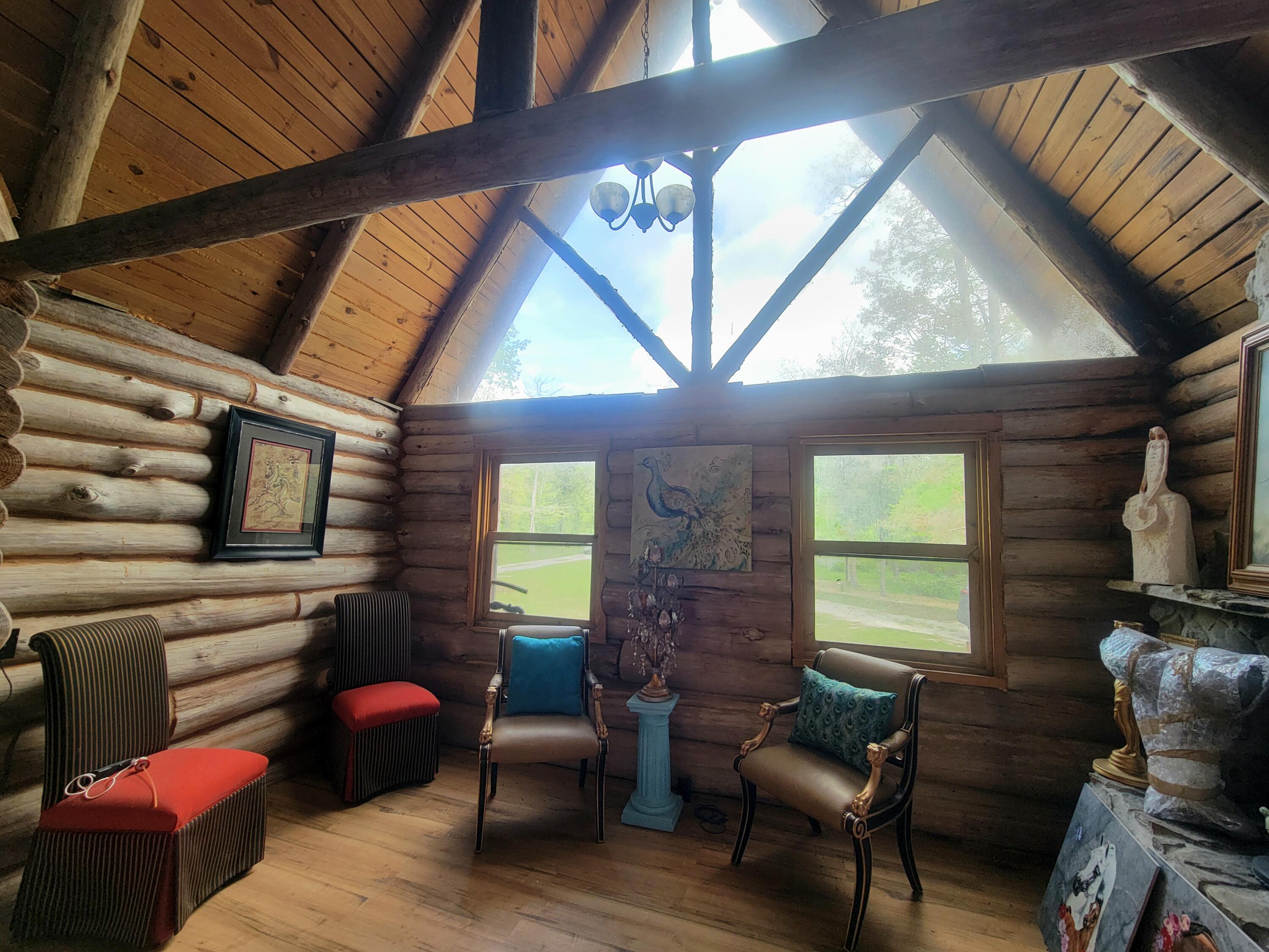1508 Crooked Creek Road Ponce de Leon, FL 32455 - Photo 40 of 62 a living room with furniture and a fireplace