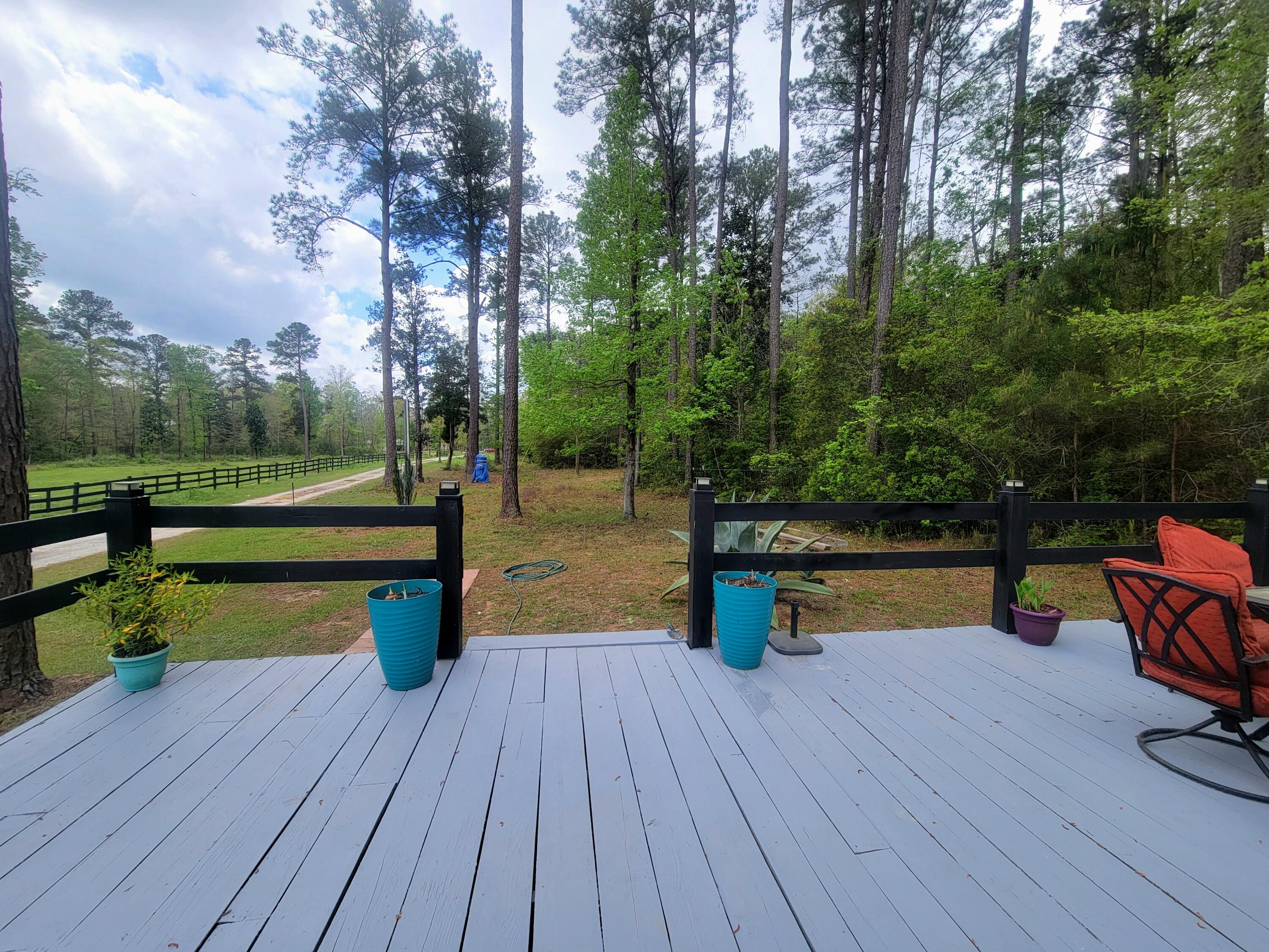 1508 Crooked Creek Road Ponce de Leon, FL 32455 - Photo 45 of 64 a park view with a bench and trees with wooden floor
