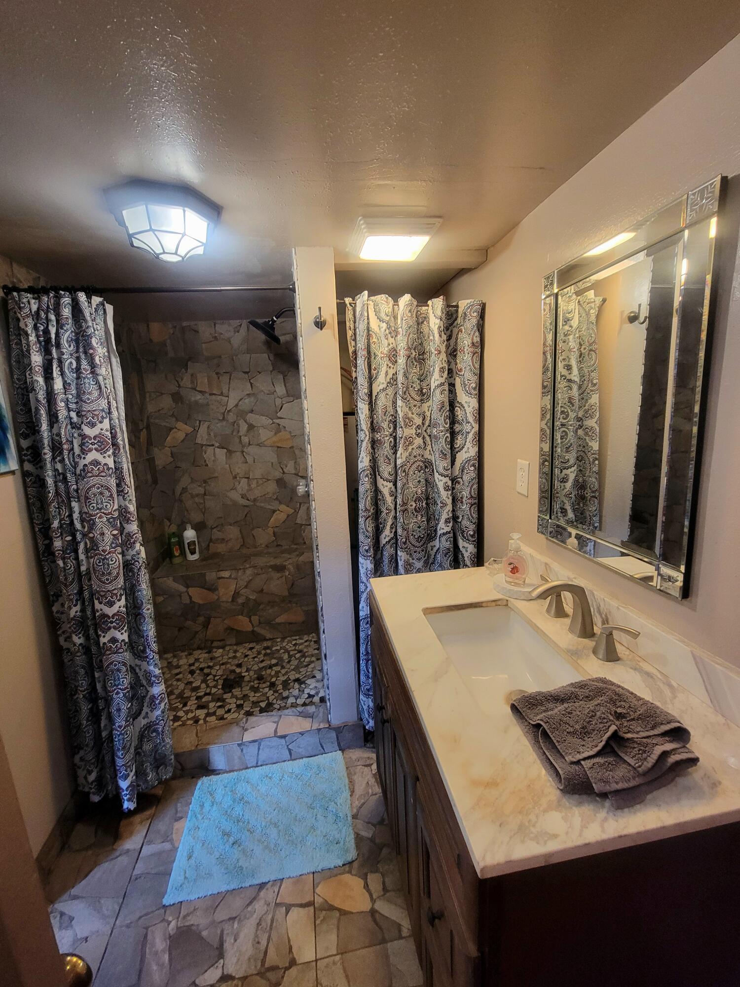 1508 Crooked Creek Road Ponce de Leon, FL 32455 - Photo 48 of 62 a bathroom with a sink a vanity and a mirror