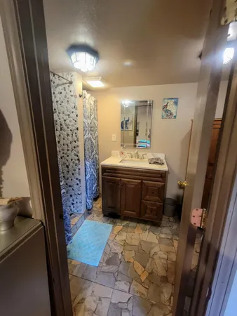 a backyard of a house with garden and patio