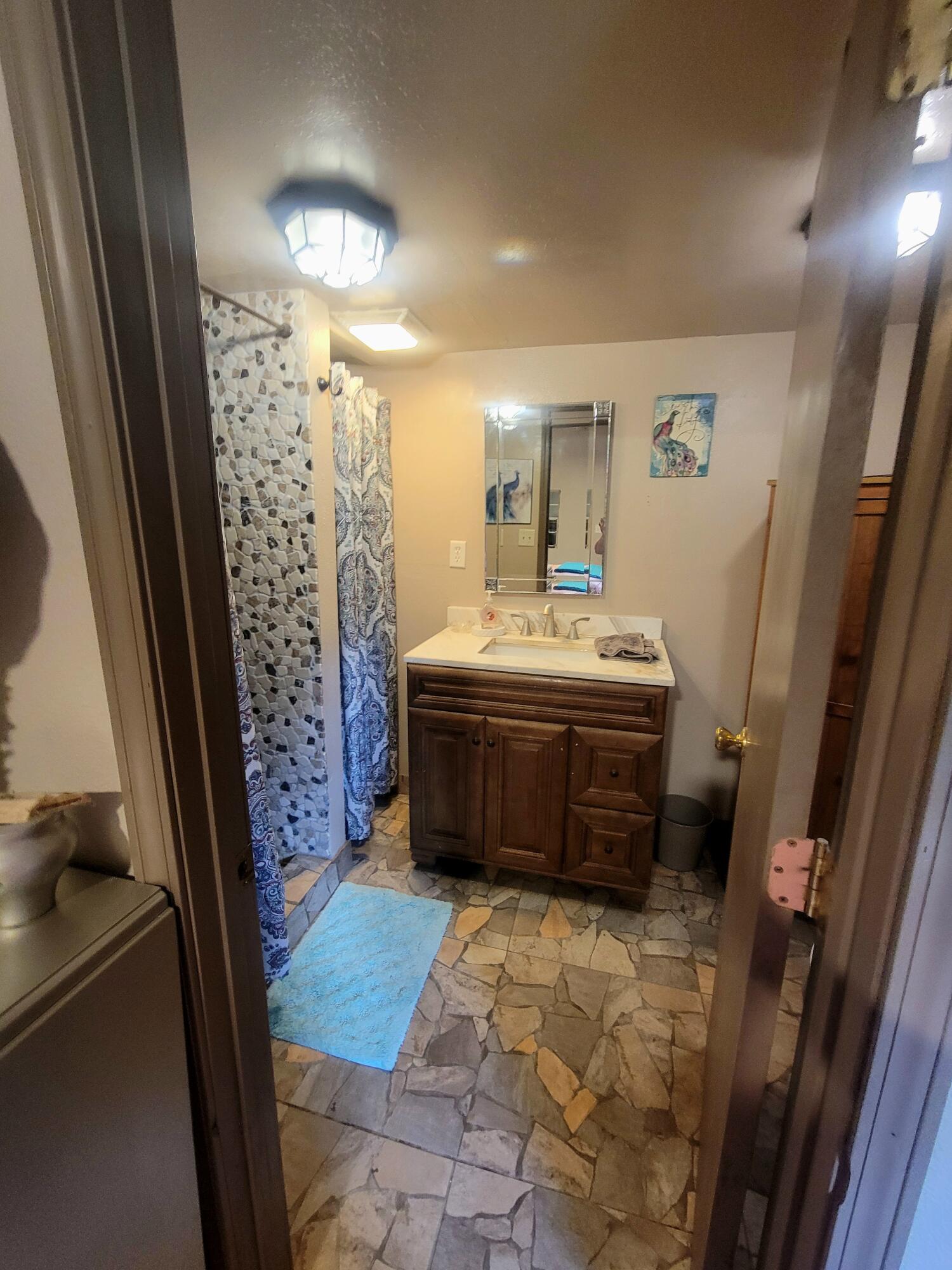 1508 Crooked Creek Road Ponce de Leon, FL 32455 - Photo 49 of 62 a bathroom with a sink a toilet and shower