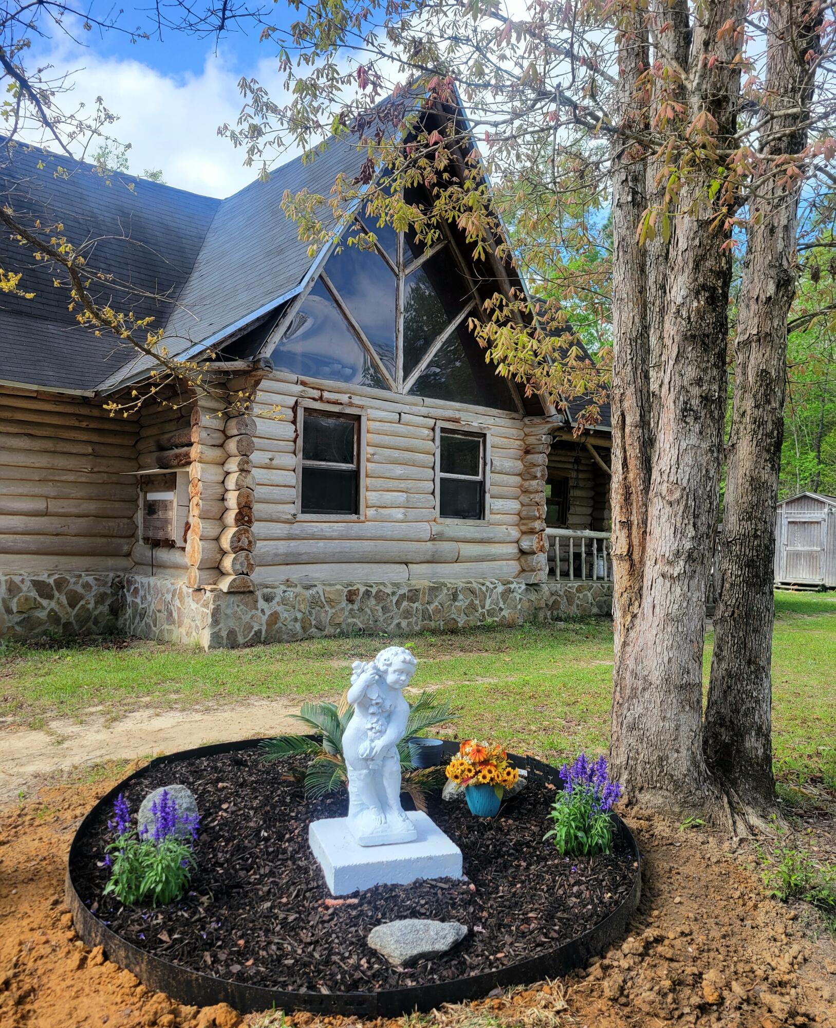 1508 Crooked Creek Road Ponce de Leon, FL 32455 - Photo 9 of 62 a front view of a house with garden