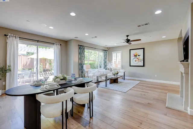 a living room with furniture flat screen tv and a fireplace