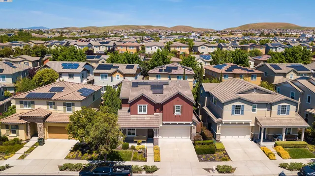 an aerial view of residential houses and street