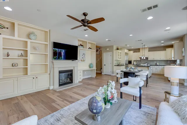 a kitchen with a sink stove and white cabinets