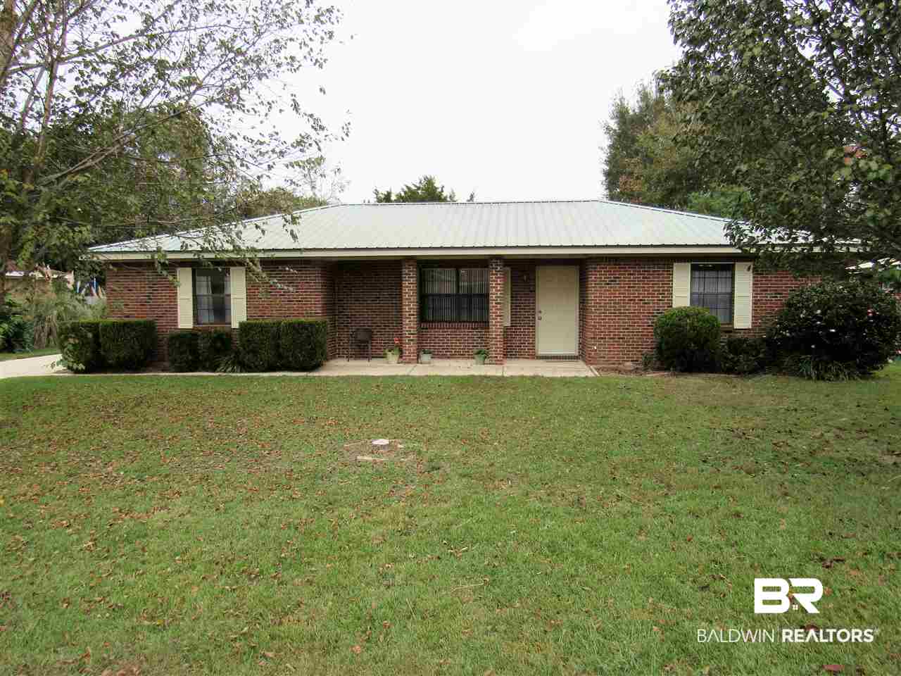 510 Ariel Avenue Foley, AL 36535 - Photo 1 of 18 Metal Roof, brick exterior, concrete driveway