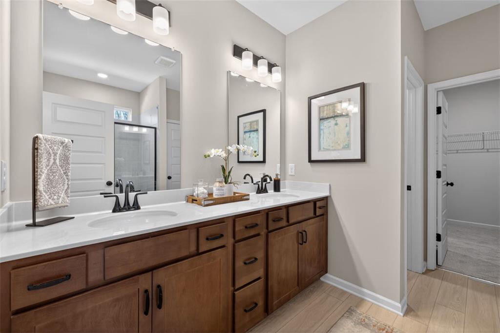 30 North Hvn Drive Rome, GA 30165 - Photo 32 of 38 a bathroom with a double vanity sink and a mirror