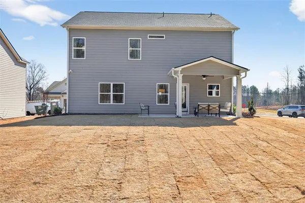 a front view of a house with yard