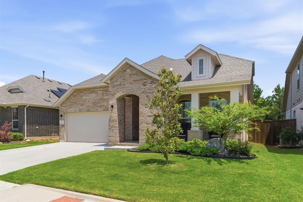 5621 Round Hl Road Denton, TX 76210 - Photo 2 of 27 a front view of a house with a yard and garage