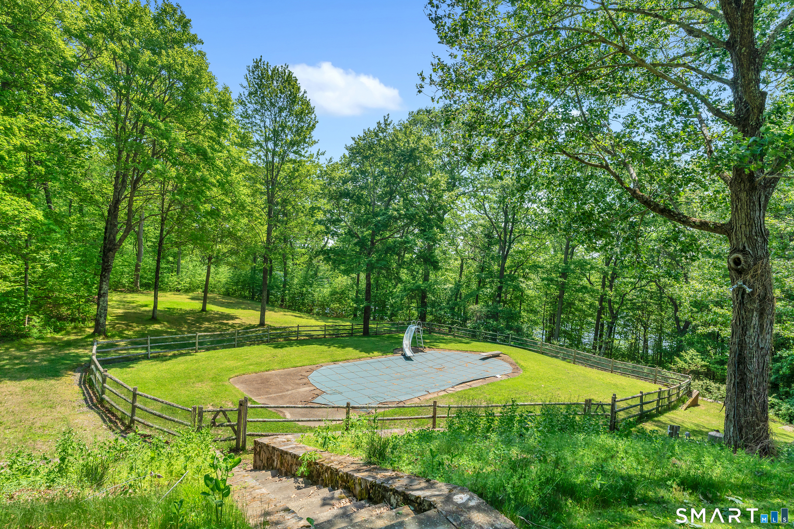 30 Maltbie Road Newtown, CT 06470 - Photo 6 of 40 a view of a backyard with a garden