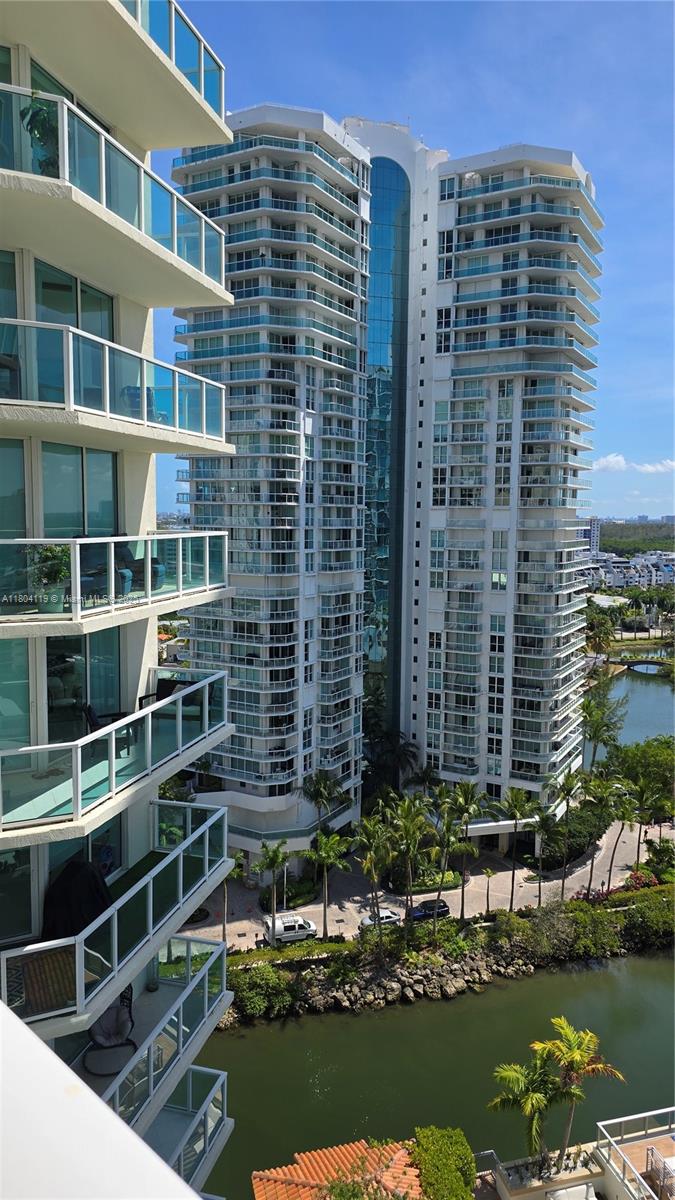 250 Sunny Isles Boulevard, Unit 31603 Sunny Isles Beach, FL 33160 - Photo 14 of 20 a view of a building with a water fall and potted plants