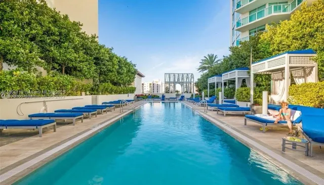 a view of swimming pool with chairs