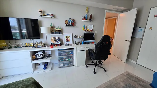 a view of workspace with computer on desk and chair