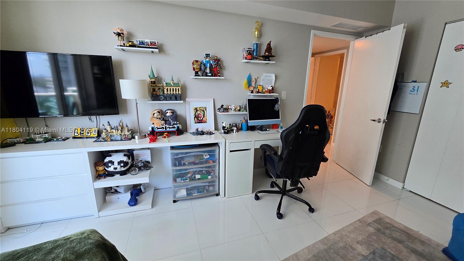 250 Sunny Isles Boulevard, Unit 31603 Sunny Isles Beach, FL 33160 - Photo 16 of 20 a view of workspace with computer on desk and chair