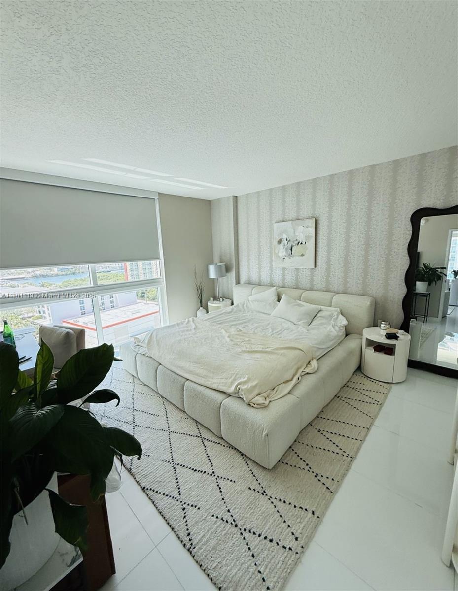 250 Sunny Isles Boulevard, Unit 31603 Sunny Isles Beach, FL 33160 - Photo 3 of 20 a bedroom with a bed and a window